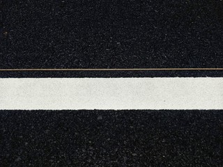 Road traffic paint White on the asphalt surface