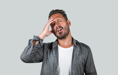 Fototapeta premium stressed and depressed attractive man suffering depression problem and anxiety crisis feeling overwhelmed and worried in pain and stress face expression isolated