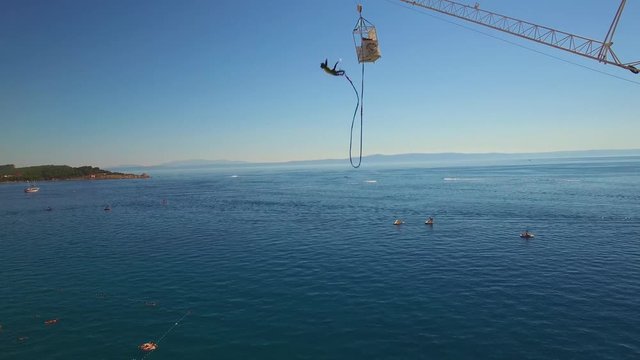 Bungee jump from a high tower over the ocean in Croatia.