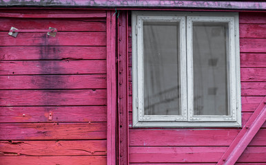 Fototapeta na wymiar White window on wooden red railway carriage close up shot.