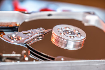 Close-up of an operating computer harddisk reading and writing data