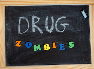 Fototapeta na wymiar Drug problem zombies message on chalkboard