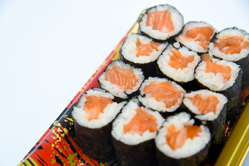 Sushi Roll with salmon on the white background .Food abstract background