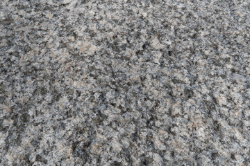 Granite crumb texture. Grey gritty rock surface. Non polished white granite as a background, texture for illustration