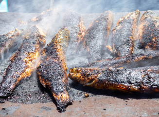 Fresh fishes on the BBQ with smoke