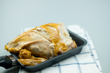 Tasty roast chicken serve on black pan