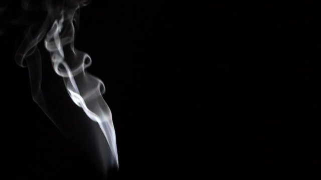Footage of the flowing smoke on the black background. 100 FPS for slow Motion