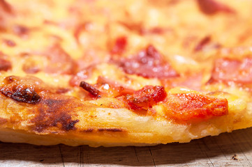 The End Crust, Edge or Lip of a Cooked Pizza on a Sheet Pan.