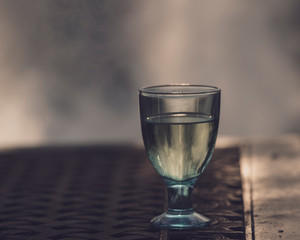 Glass of wine outdoor fire background.