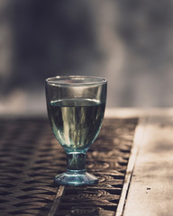 Glass of wine outdoor fire background.