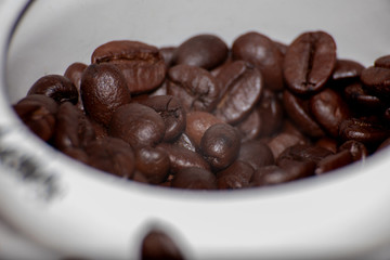 Coffee beans on a wooden table close-up