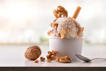 Walnuts ice cream cup on white table homemade in kitchen