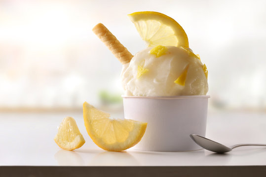 Lemon ice cream cup on white table homemade in kitchen