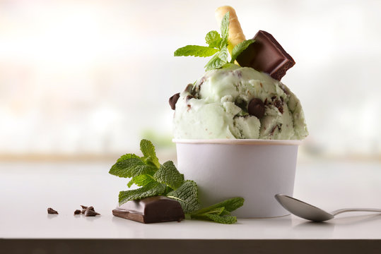 Mint ice cream cup on white table homemade in kitchen