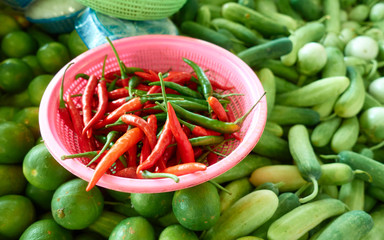 fresh red and green chilli in basket