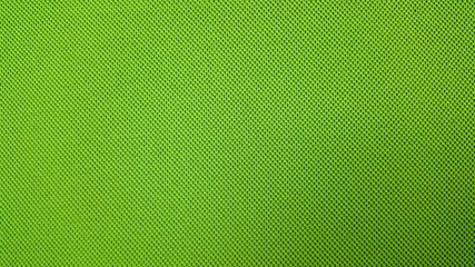 Green background textile material with pattern, closeup.