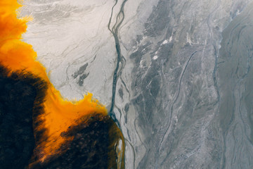 Naklejka premium Drone view of contaminated, toxic water stream in Geamana, Romania