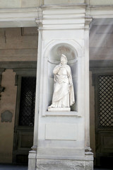 Fototapeta premium Statue of Francesco Petrarca in the niches of the Uffizi Gallery colonnade, Florence.