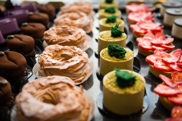 Delicious cakes on display with dark background