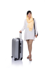 full length photo of muslim woman with suitcase smiling to camera