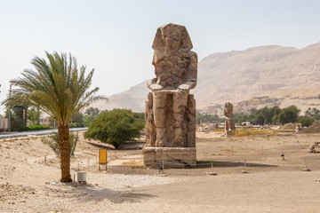 A massive statue of Amenhotep III on the west bank of the Nile, Luxor, Egypt