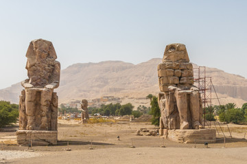 Two massive stone statues Colossi of Memnon Thebes, Luxor, Egypt