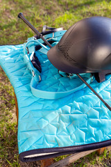 Equipment for horse riding outdoors: bridle, whip, helmet, bandages