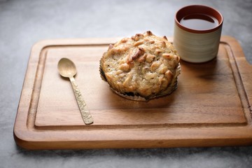 Butter scotch on wooden plate and stone background