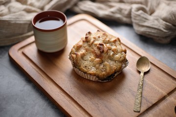Butter scotch on wooden plate and stone background
