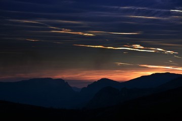 the silhouettes of the Carpathian mountains at sunset