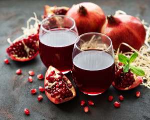 Pomegranate juice with fresh pomegranate fruits