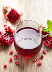 Pomegranate juice with fresh pomegranate fruits