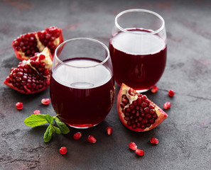 Pomegranate juice with fresh pomegranate fruits