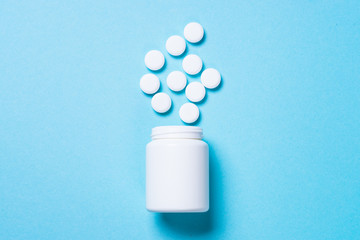 Pills on blue top view.