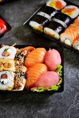 Sushi set with salmon, soft cheese, tuna, smoked eel. Sushi delivery to home. Healthy food. Top view. 