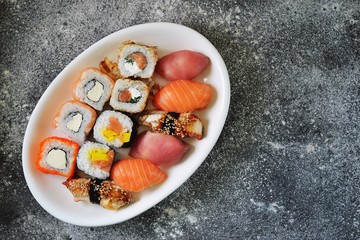 Sushi set with salmon, soft cheese, tuna, smoked eel. Sushi delivery to home. Healthy food. Top view. 