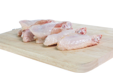 Raw chicken  on cutting board on white background