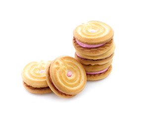 sandwich cookies with strawberry cream on white background