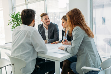 Business people working together on project and brainstorming in office