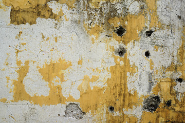 Yellow grunge cement wall, textured background