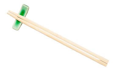 top view of disposable chopsticks on rest isolated