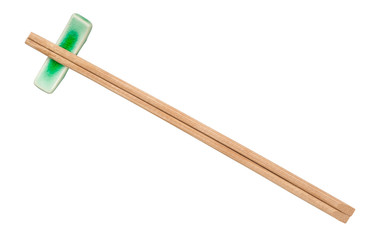top view of brown wooden chopsticks on rest