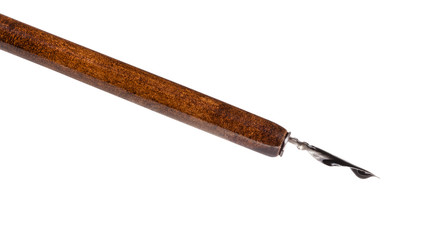 steel nib filled by black ink in brown dip pen