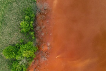 Drone view of contaminated, toxic water stream in Geamana, Romania