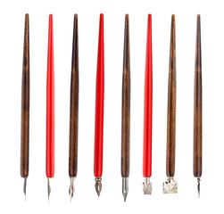 red and brown penholders with various nibs