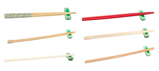 set of various wooden chopsticks on rest isolated