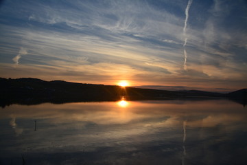 a beautiful sunset on the lake	