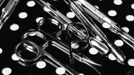 Professional manicure tools. Closeup Of Nail Care Tools. set of metallic manicure tools macro...