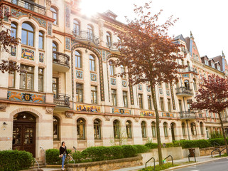 Fototapeta premium Lady walks in an European city streets