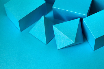Blue color geometrical figures still life composition. Three-dimensional prism pyramid rectangular...
